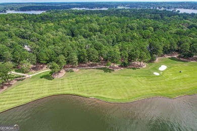 Located in the prestigious Great Waters neighborhood of Reynolds on Great Waters Course At Reynolds Plantation in Georgia - for sale on GolfHomes.com, golf home, golf lot