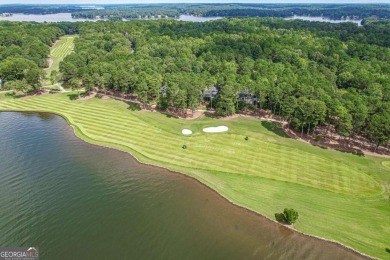 Located in the prestigious Great Waters neighborhood of Reynolds on Great Waters Course At Reynolds Plantation in Georgia - for sale on GolfHomes.com, golf home, golf lot