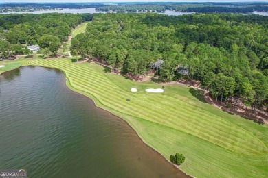 Located in the prestigious Great Waters neighborhood of Reynolds on Great Waters Course At Reynolds Plantation in Georgia - for sale on GolfHomes.com, golf home, golf lot