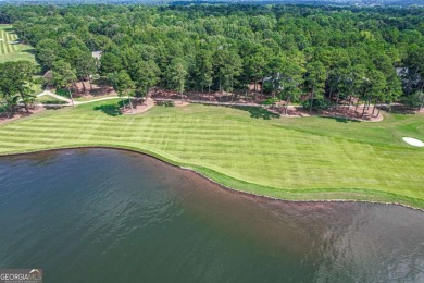 Located in the prestigious Great Waters neighborhood of Reynolds on Great Waters Course At Reynolds Plantation in Georgia - for sale on GolfHomes.com, golf home, golf lot