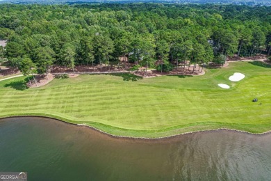 Located in the prestigious Great Waters neighborhood of Reynolds on Great Waters Course At Reynolds Plantation in Georgia - for sale on GolfHomes.com, golf home, golf lot