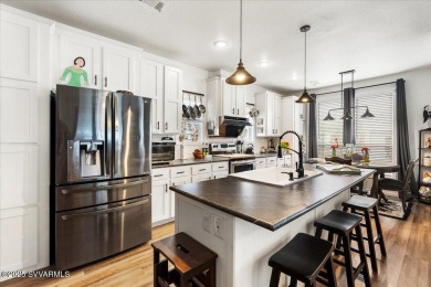 This 55+ community home features a beautifully appointed kitchen on Pine Shadows Golf Course in Arizona - for sale on GolfHomes.com, golf home, golf lot