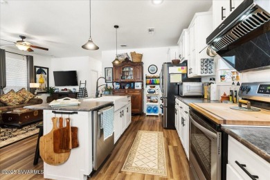 This 55+ community home features a beautifully appointed kitchen on Pine Shadows Golf Course in Arizona - for sale on GolfHomes.com, golf home, golf lot