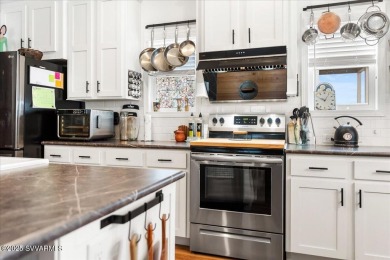 This 55+ community home features a beautifully appointed kitchen on Pine Shadows Golf Course in Arizona - for sale on GolfHomes.com, golf home, golf lot