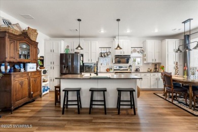 This 55+ community home features a beautifully appointed kitchen on Pine Shadows Golf Course in Arizona - for sale on GolfHomes.com, golf home, golf lot