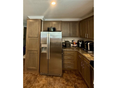 Why Buy New?!?! This immaculate and meticulously maintained 2017 on Riverwood Golf Club in Florida - for sale on GolfHomes.com, golf home, golf lot