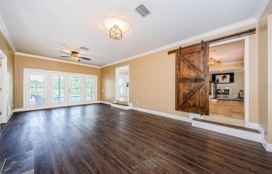 Lovely Tudor home with expansive golf course views front and on Bardmoor Golf and Tennis Club in Florida - for sale on GolfHomes.com, golf home, golf lot