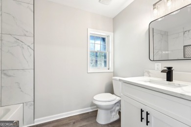Welcome home to your charming & thoughtfully renovated all brick on Hunter Pope Country Club in Georgia - for sale on GolfHomes.com, golf home, golf lot