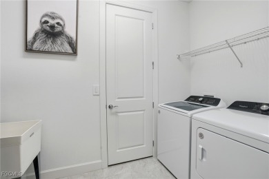 Discover elegant Florida living in this spacious 3-bedroom + den on River Hall Country Club in Florida - for sale on GolfHomes.com, golf home, golf lot