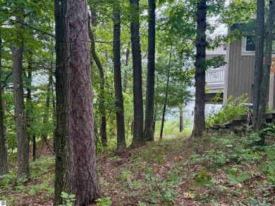 Discover a one-of-a-kind opportunity to build your dream cottage on  in Michigan - for sale on GolfHomes.com, golf home, golf lot