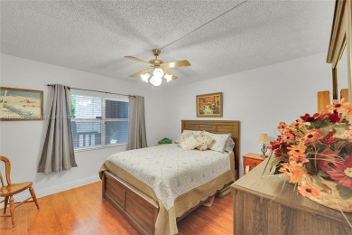Updated custom kitchen, bathroom and floors, beautiful view of on Sunrise Lakes Phase III in Florida - for sale on GolfHomes.com, golf home, golf lot