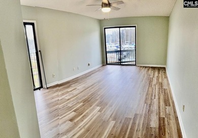 Come home and relax overlooking the water and boats in the cove on Club At Rawls Creek in South Carolina - for sale on GolfHomes.com, golf home, golf lot