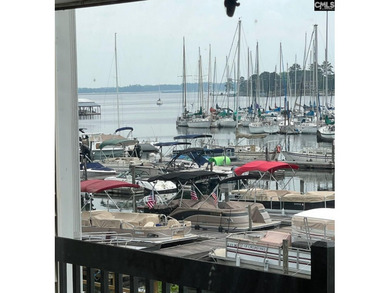 Come home and relax overlooking the water and boats in the cove on Club At Rawls Creek in South Carolina - for sale on GolfHomes.com, golf home, golf lot