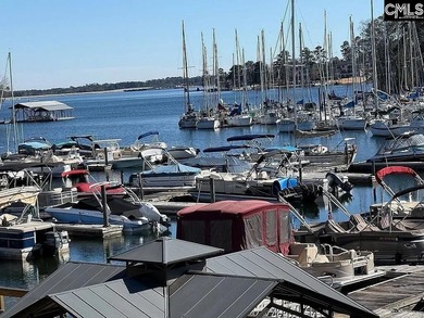 Come home and relax overlooking the water and boats in the cove on Club At Rawls Creek in South Carolina - for sale on GolfHomes.com, golf home, golf lot