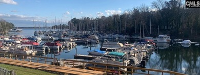 Come home and relax overlooking the water and boats in the cove on Club At Rawls Creek in South Carolina - for sale on GolfHomes.com, golf home, golf lot