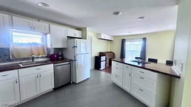 This home has been completely remodeled inside (2023-2024); with on Riverbend Golf and Country Club in Florida - for sale on GolfHomes.com, golf home, golf lot
