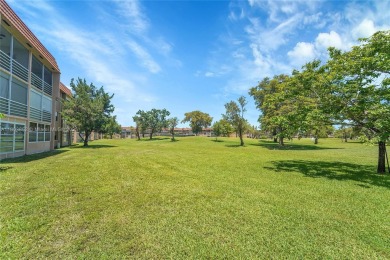 Updated custom kitchen, bathroom and floors, beautiful view of on Sunrise Lakes Phase III in Florida - for sale on GolfHomes.com, golf home, golf lot