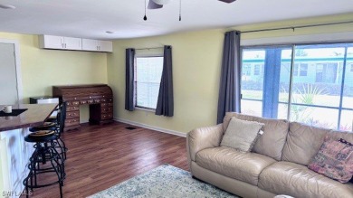 This home has been completely remodeled inside (2023-2024); with on Riverbend Golf and Country Club in Florida - for sale on GolfHomes.com, golf home, golf lot