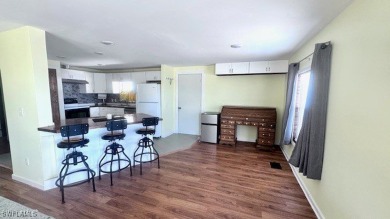 This home has been completely remodeled inside (2023-2024); with on Riverbend Golf and Country Club in Florida - for sale on GolfHomes.com, golf home, golf lot