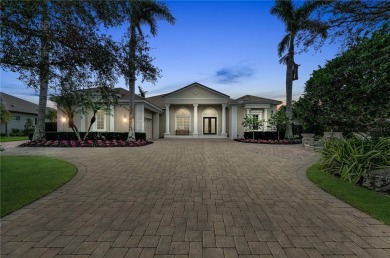 This custom residence in the prestigious Founders Club blends on The Founders Golf Club in Florida - for sale on GolfHomes.com, golf home, golf lot