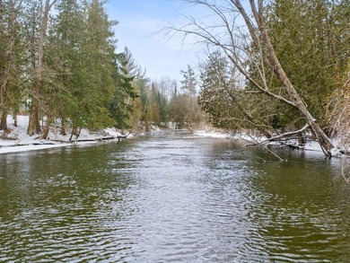 Welcome to this beautifully crafted riverfront home along the on Thunder Bay Golf Resort in Michigan - for sale on GolfHomes.com, golf home, golf lot