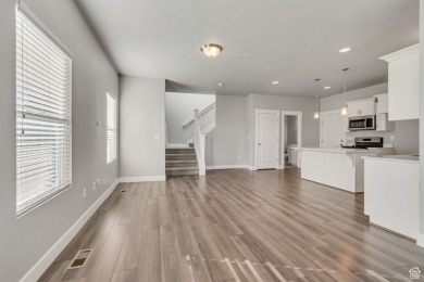 Enjoy laminate floors, an open kitchen with quartz counters on The Ranches Golf Club in Utah - for sale on GolfHomes.com, golf home, golf lot