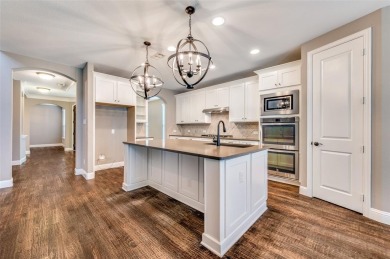 Discover lakeside living at its finest in this stunning on The Tribute At the Colony in Texas - for sale on GolfHomes.com, golf home, golf lot
