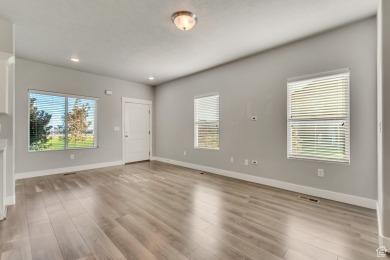 Enjoy laminate floors, an open kitchen with quartz counters on The Ranches Golf Club in Utah - for sale on GolfHomes.com, golf home, golf lot