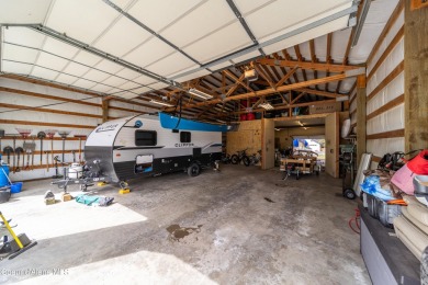 This 4b/2b home with a 40x60 shop is just a few minutes from two on Ranch Club Golf Course in Idaho - for sale on GolfHomes.com, golf home, golf lot