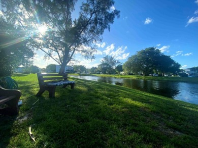 Great Location, fully remodeled and furnished with a modern on Hillsboro Pines Golf in Florida - for sale on GolfHomes.com, golf home, golf lot