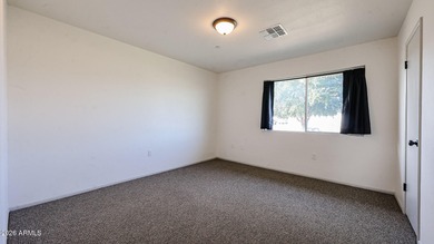 This Sun City home is freshly painted inside and out with on Sun City Lakes West and East in Arizona - for sale on GolfHomes.com, golf home, golf lot