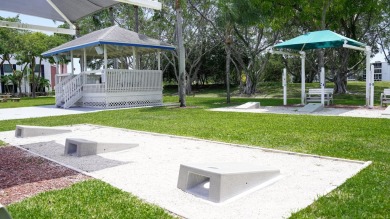 Beautiful 1 bed, 1 bath condo with an open floor plan located on on Hillsboro Pines Golf in Florida - for sale on GolfHomes.com, golf home, golf lot