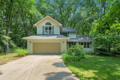 Tucked away on a large, private, wooded lot, this beautifully on Ridgeview Golf Course in Michigan - for sale on GolfHomes.com, golf home, golf lot