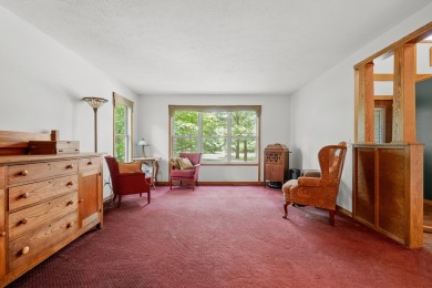 Tucked away on a large, private, wooded lot, this beautifully on Ridgeview Golf Course in Michigan - for sale on GolfHomes.com, golf home, golf lot