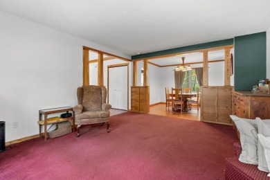 Tucked away on a large, private, wooded lot, this beautifully on Ridgeview Golf Course in Michigan - for sale on GolfHomes.com, golf home, golf lot