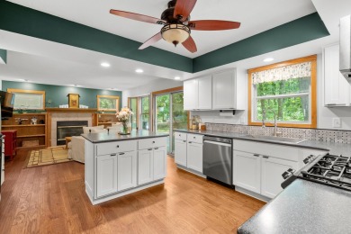Tucked away on a large, private, wooded lot, this beautifully on Ridgeview Golf Course in Michigan - for sale on GolfHomes.com, golf home, golf lot