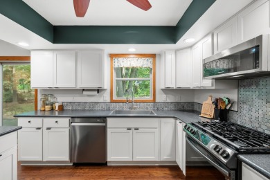 Tucked away on a large, private, wooded lot, this beautifully on Ridgeview Golf Course in Michigan - for sale on GolfHomes.com, golf home, golf lot