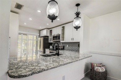 STUNNING KITCHEN W/ SHAKER CABINETS  QUARTZ COUNTERS, VINYL on Mainlands Golf Club in Florida - for sale on GolfHomes.com, golf home, golf lot