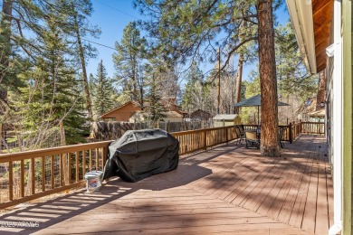 This stunning home is nestled in one of Munds Park's most on Pinewood Country Club in Arizona - for sale on GolfHomes.com, golf home, golf lot