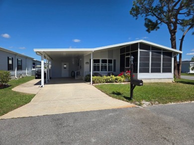 Don't miss this beautiful 2/2 home in the highly sought-after on Lake Henry Golf Club in Florida - for sale on GolfHomes.com, golf home, golf lot