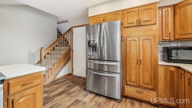 This home has had extreme care and is completely move in ready! on Escanaba Country Club in Michigan - for sale on GolfHomes.com, golf home, golf lot