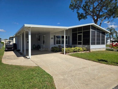 Don't miss this beautiful 2/2 home in the highly sought-after on Lake Henry Golf Club in Florida - for sale on GolfHomes.com, golf home, golf lot