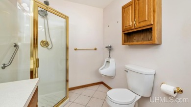 This home has had extreme care and is completely move in ready! on Escanaba Country Club in Michigan - for sale on GolfHomes.com, golf home, golf lot