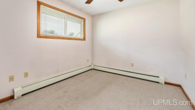 This home has had extreme care and is completely move in ready! on Escanaba Country Club in Michigan - for sale on GolfHomes.com, golf home, golf lot