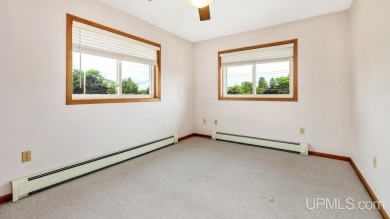 This home has had extreme care and is completely move in ready! on Escanaba Country Club in Michigan - for sale on GolfHomes.com, golf home, golf lot