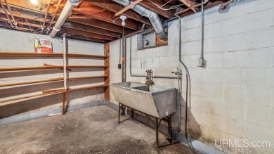 This home has had extreme care and is completely move in ready! on Escanaba Country Club in Michigan - for sale on GolfHomes.com, golf home, golf lot