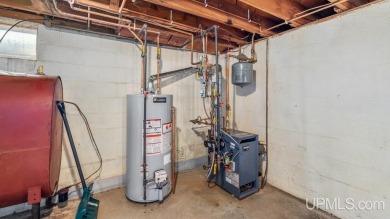 This home has had extreme care and is completely move in ready! on Escanaba Country Club in Michigan - for sale on GolfHomes.com, golf home, golf lot