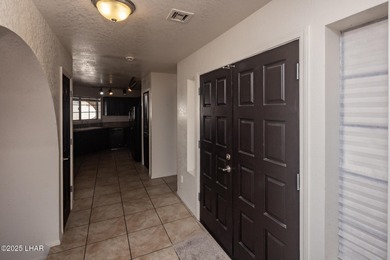 Ideally located just minutes from the golf course, this on London Bridge Golf Course in Arizona - for sale on GolfHomes.com, golf home, golf lot