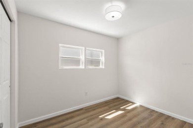 Show stopper! This totally remodeled rare 3 bedroom/2 bath on Mangrove Bay Golf Course in Florida - for sale on GolfHomes.com, golf home, golf lot