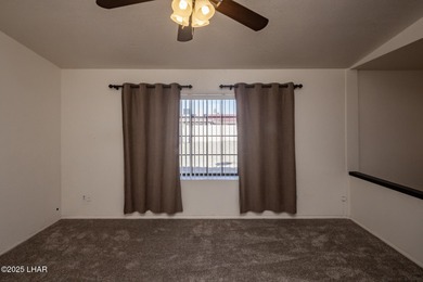 Ideally located just minutes from the golf course, this on London Bridge Golf Course in Arizona - for sale on GolfHomes.com, golf home, golf lot